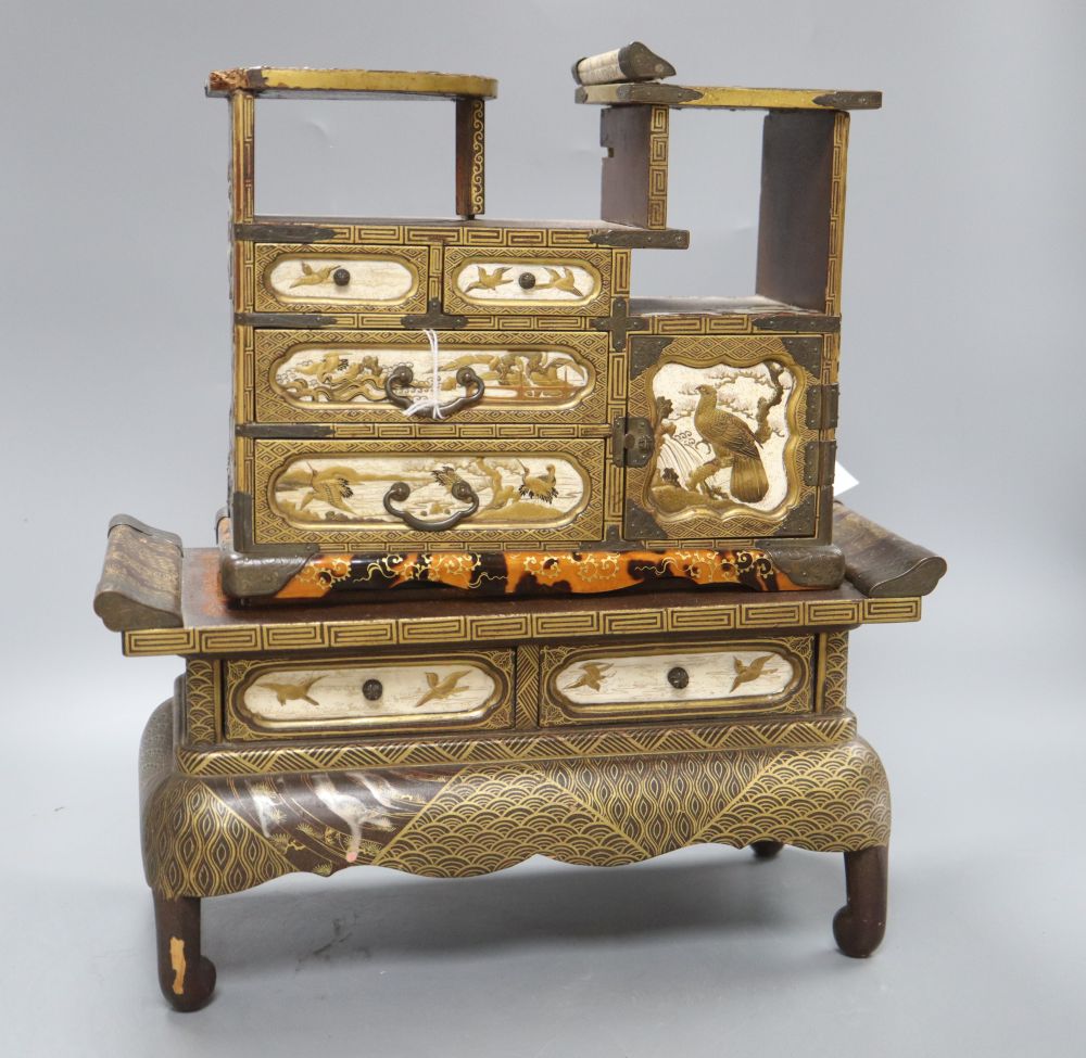 A Japanese Meiji lacquer table cabinet and similar stand, overall height 37.5cm